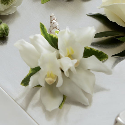 White Mini Cymbidium Boutonniere –  Brown Pleasance Florists Inc, Lakewood OH